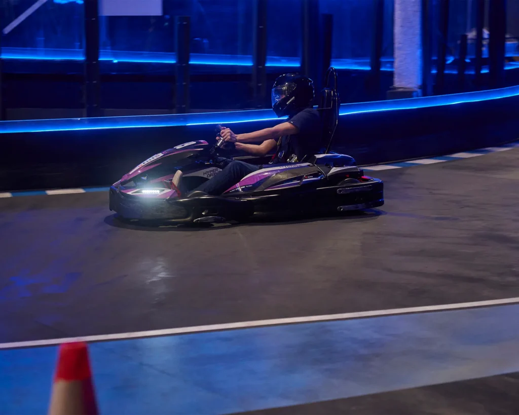 Racer speeds past turn in track