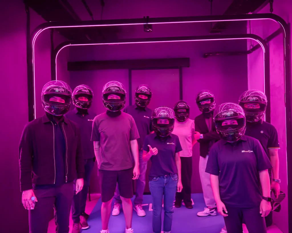Group photo in neon room before the race
